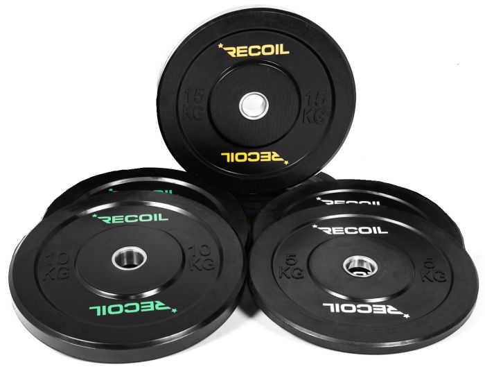 Flera viktskivor med olika vikter 