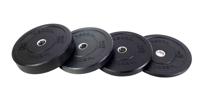 Fyra svarta viktskivor med olika vikter